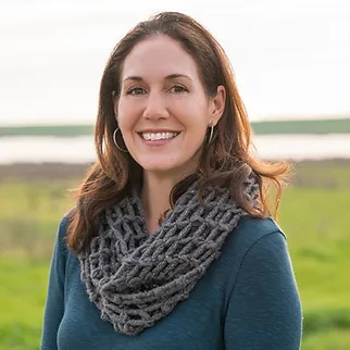 janelle smiling in field