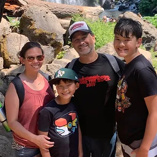 family smiling on hike