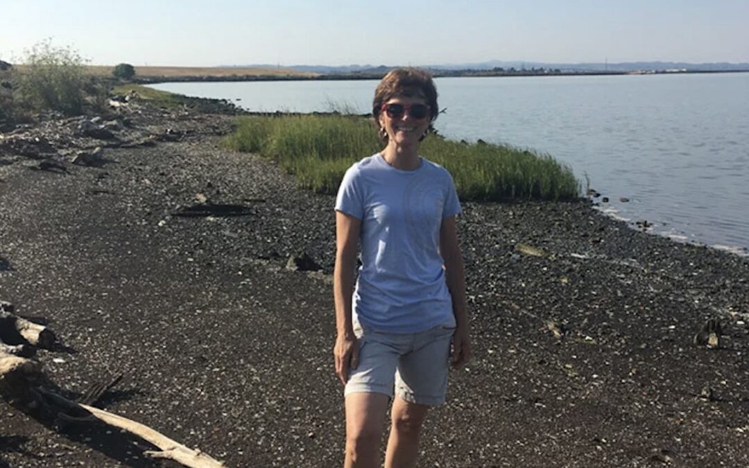 becky smiling in front of wetlands