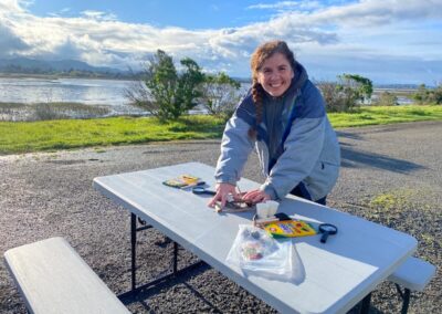 woman at picnic table doing outdoor activity