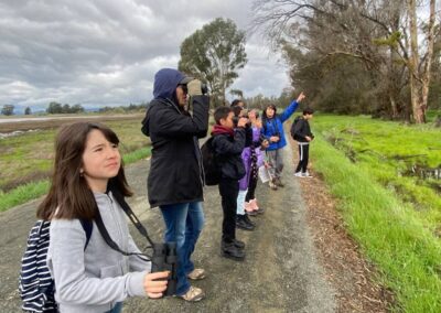 children watching birds on trail