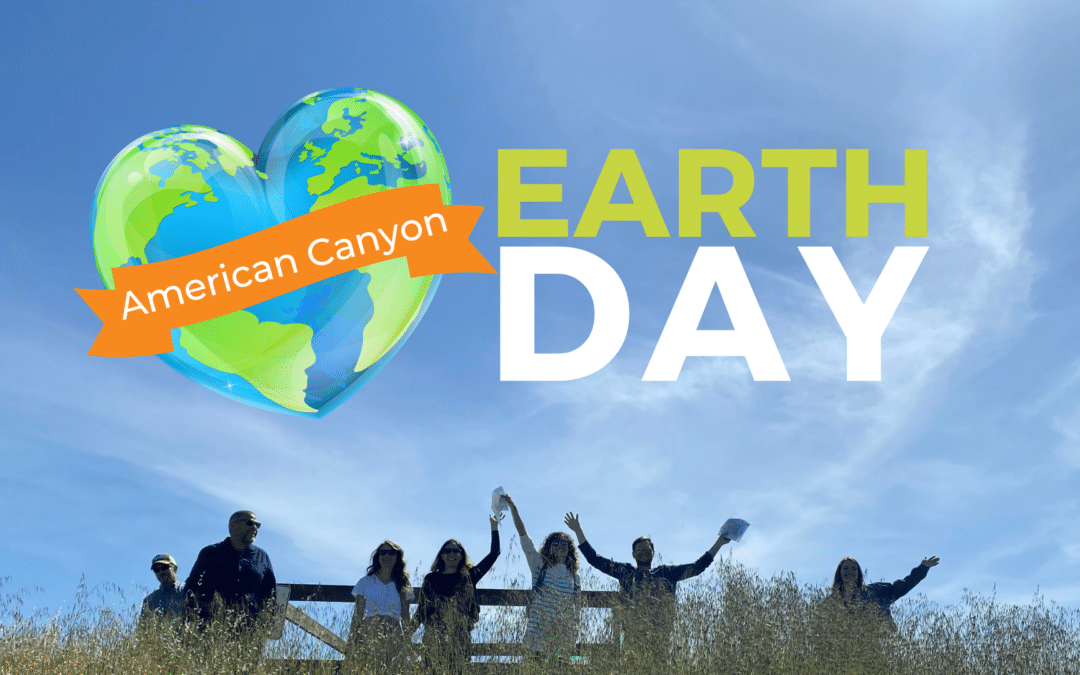 Earth Day image with people in grass and their hands up in celebration