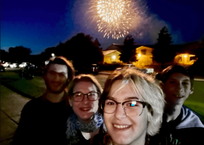 family selfie with fireworks