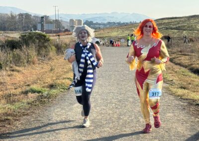 Two lady in amacing Ziggy Stardust like glam costumes running in the reindeer run