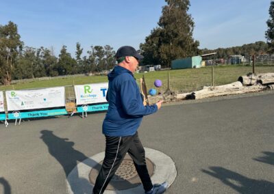 Man walking the 5 K while contantly juggling