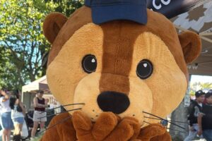 Photo of new Otter Mascot in an Eco Center Hat